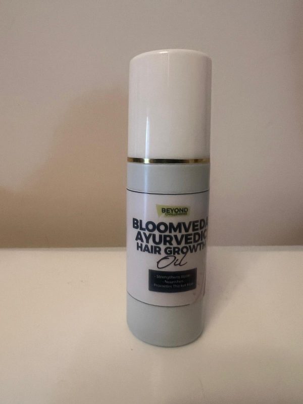 Bloomveda Ayurvedic Hair Growth Oil bottle with a white cap
