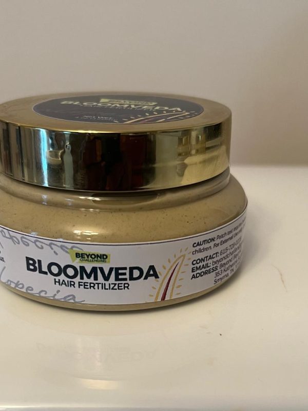 Bloomveda Hair Fertilizer jar with a gold lid
